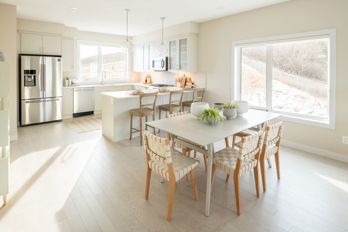 Open concept kitchen and living area at Trinity Hills, Calgary townhomes
